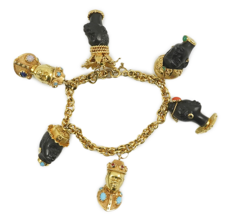 A late 20th century Italian 18k gold charm bracelet, hung with six assorted Italian 18k gold and gem set mounted blackamoor busts, together with a matching brooch